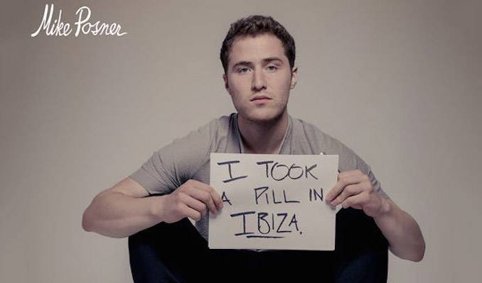 A man holding a sign that says i took a fill in iraq.