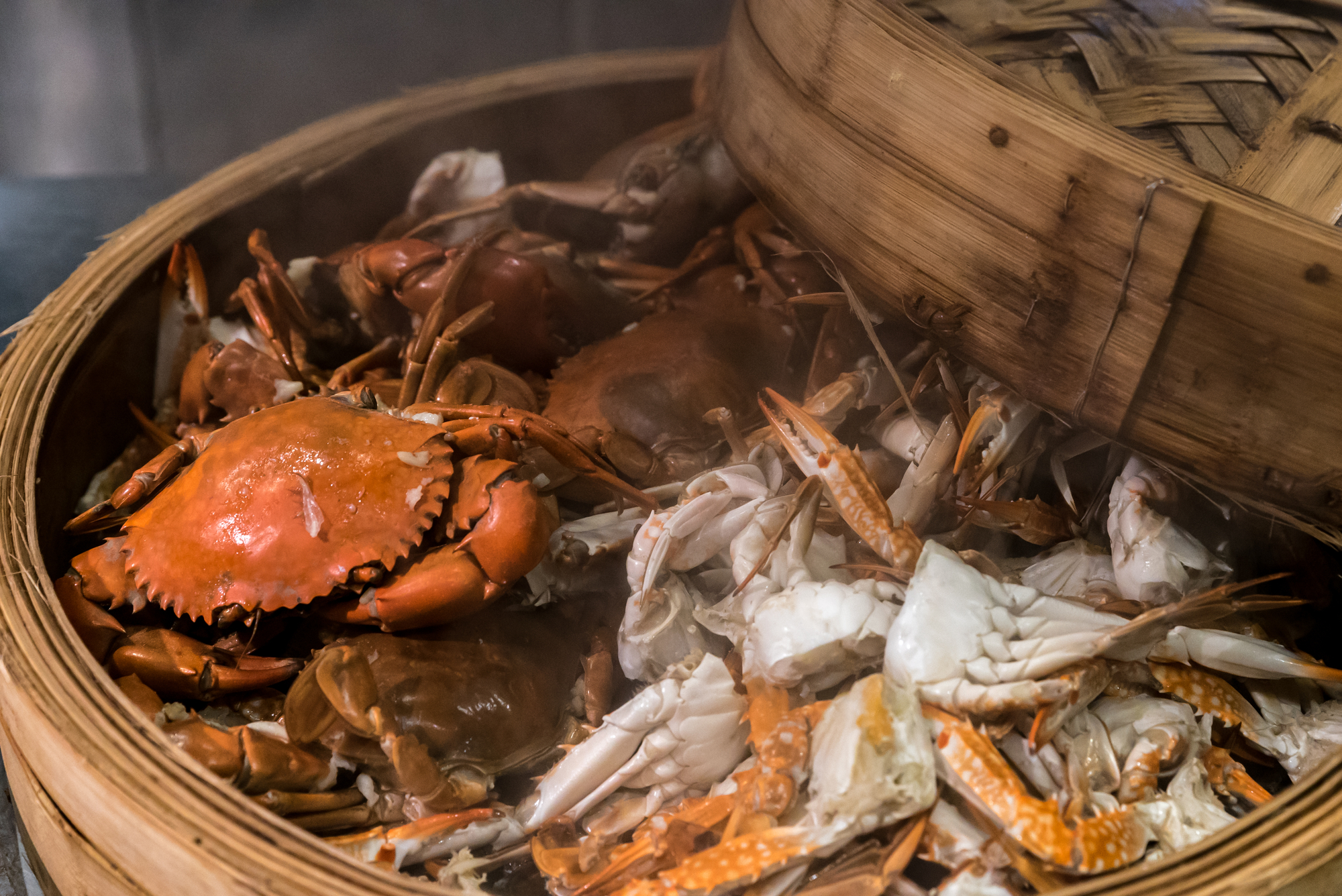 Crabs in a bamboo basket on a table at the Maryland Day Festival.