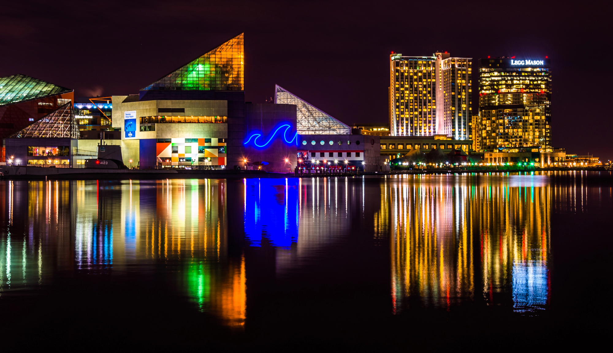 A Maryland city building is reflected in a body of water during a Day Festival.